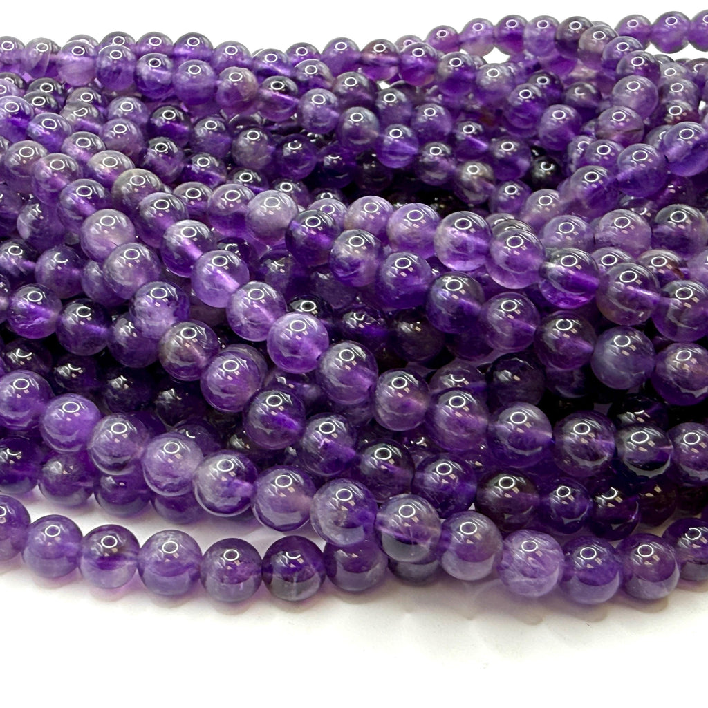 bundle of dark purple amethyst bead strands, smooth round gemstones ideal for necklace and bracelet making