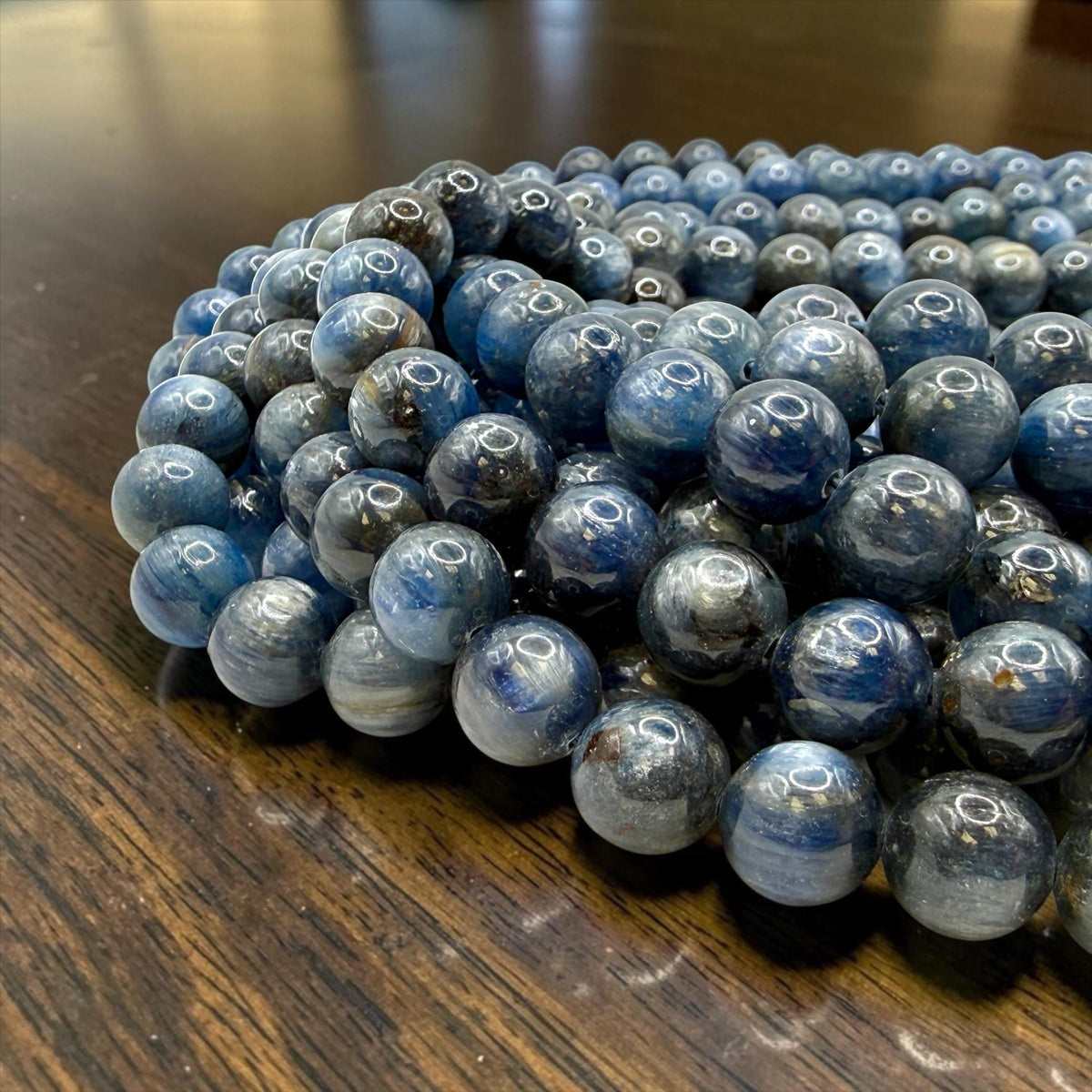 natural blue kyanite beads detail fibrous texture silky glow Minas Gerais Brazil gemstone supply