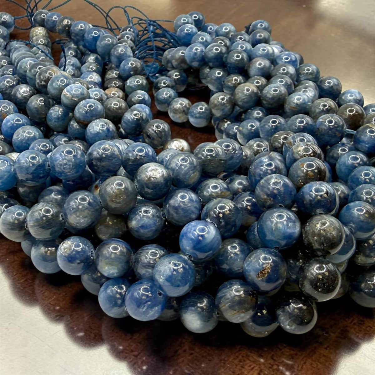 Brazilian blue kyanite beads close up showing deep sapphire color and natural silky shimmer texture